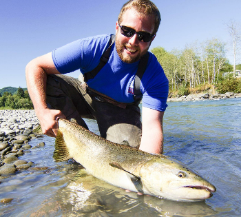 Fishing Guide Patric Gaffney displaying a Hoh river King salmon caught on one of his guided fishing trips on the Hoh river